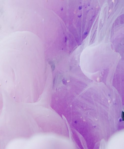 Abstract swirling violet smoke symbolizing energy flow